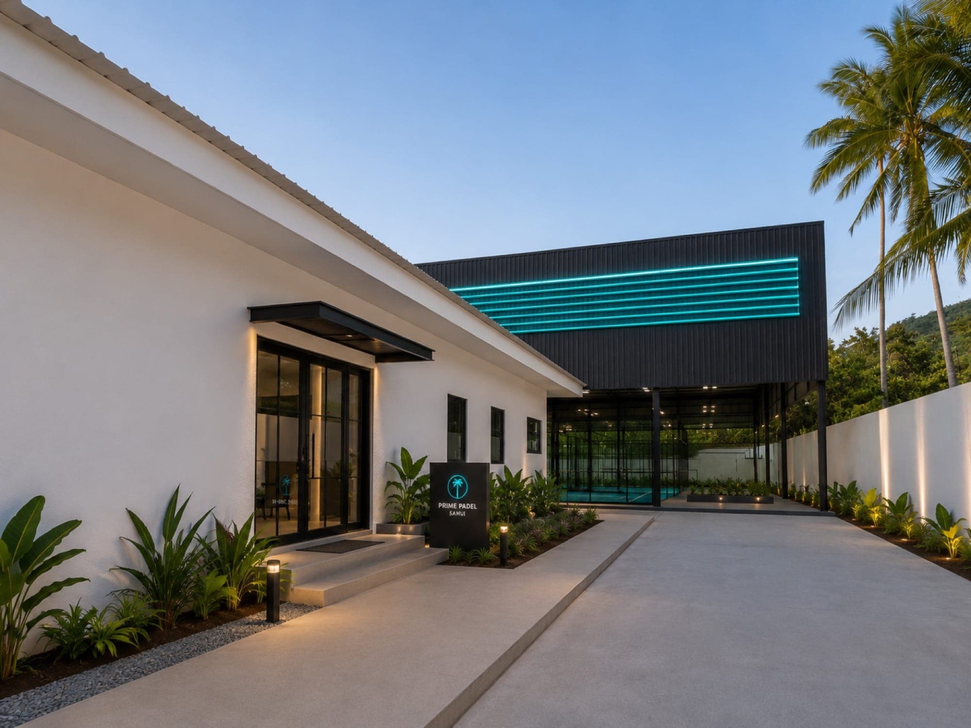 Club entrance and walkway lit at dusk