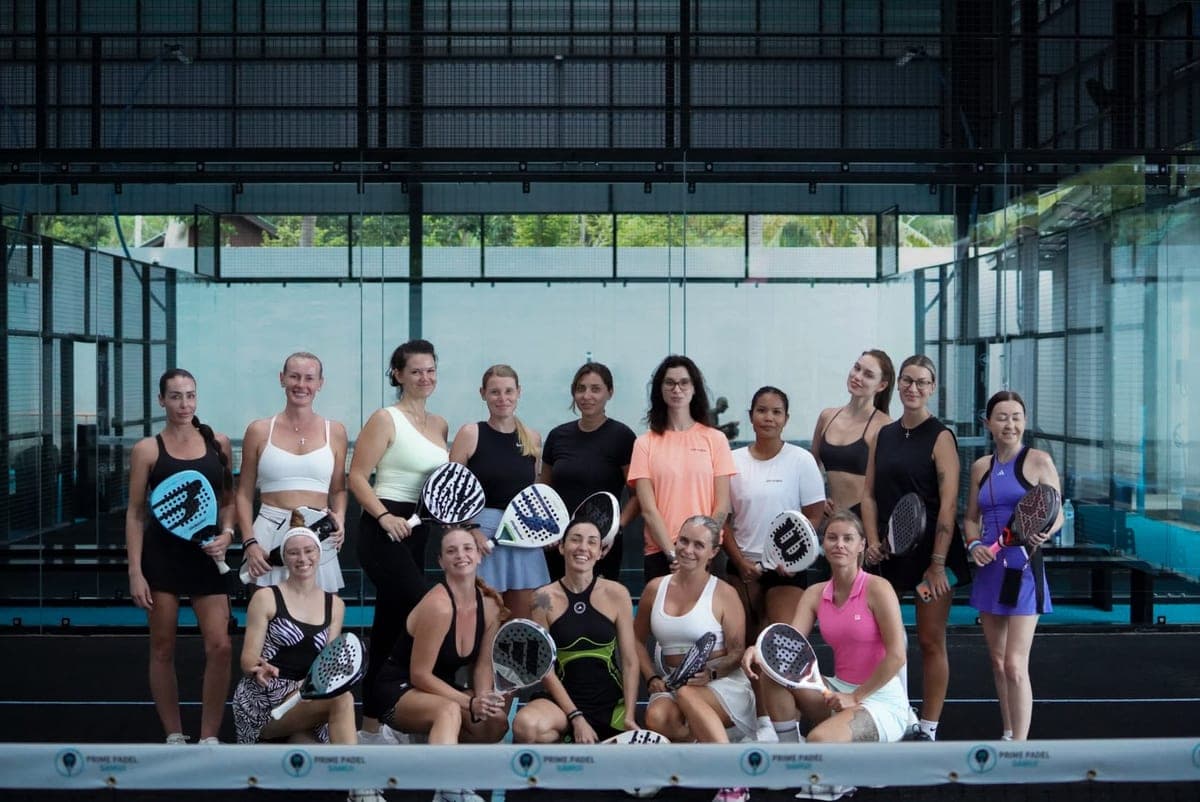 Sixteen players with rackets on court at the soft-opening ladies' session